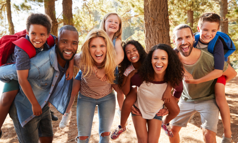 Children of diverse families enjoying time in nature.