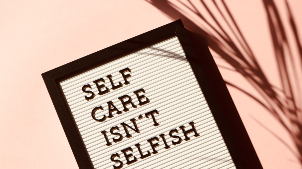 a sign saying self care isn't selfish