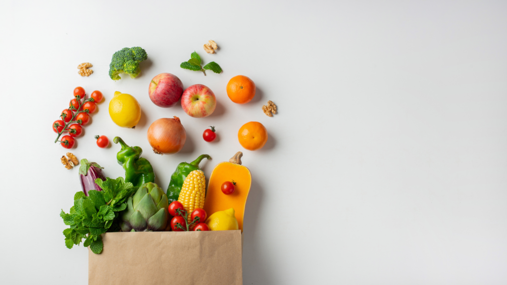 A grocery bag overflowing with vegan ingredients.