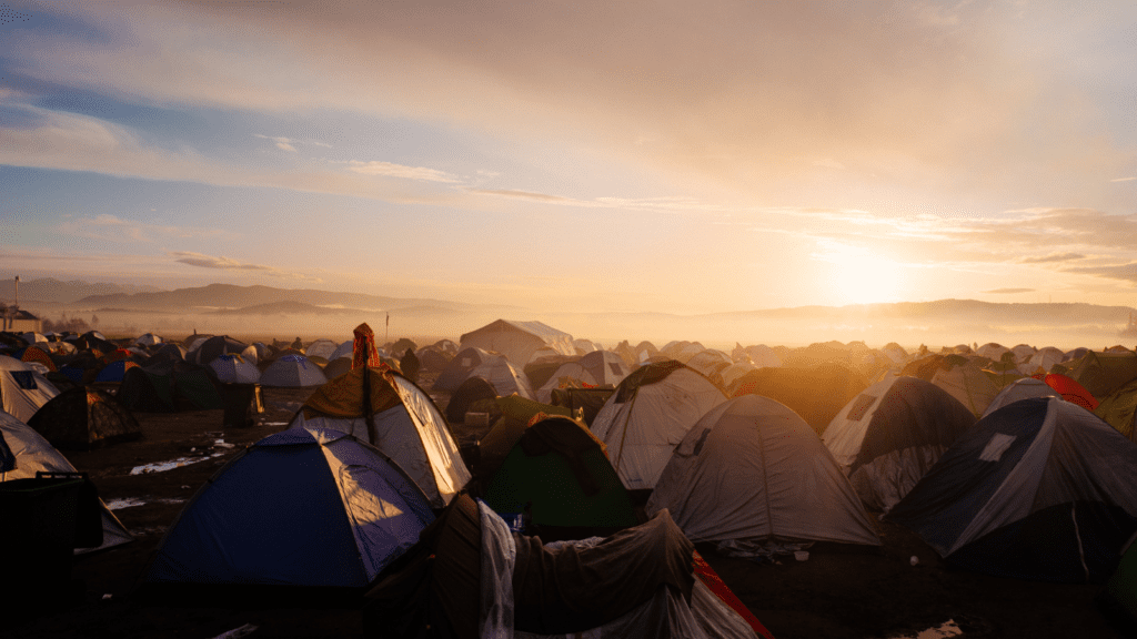 Tents in a refugee camp, where refugees must show resilience and determination.