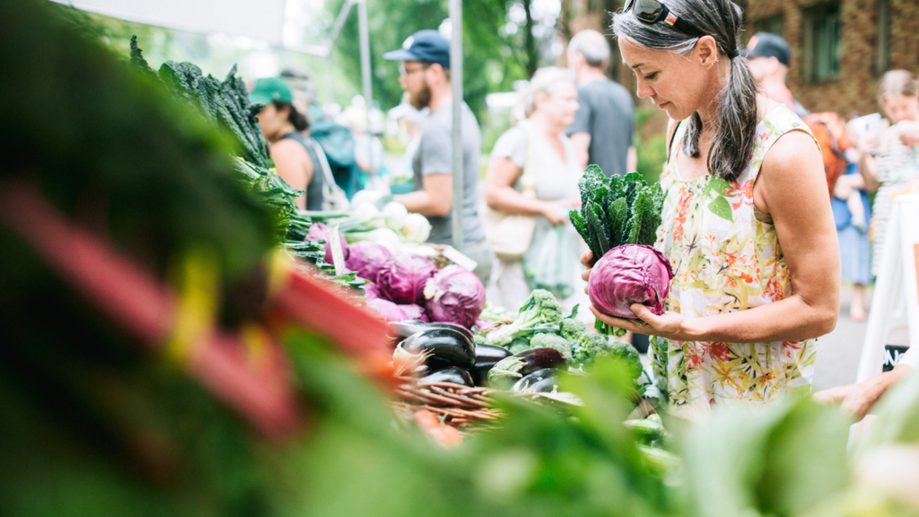 Shopping at a local farmers' market with your own bags can help reduce your plastic footprint.